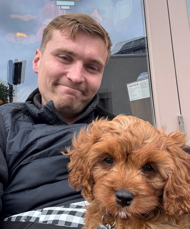 Matt Harker with his cavapoo puppy, Nevis